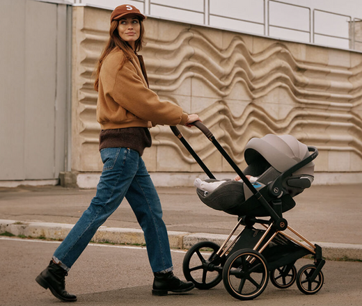 Woman pushing Cybex stroller