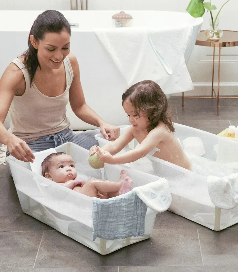 mother bathing two children