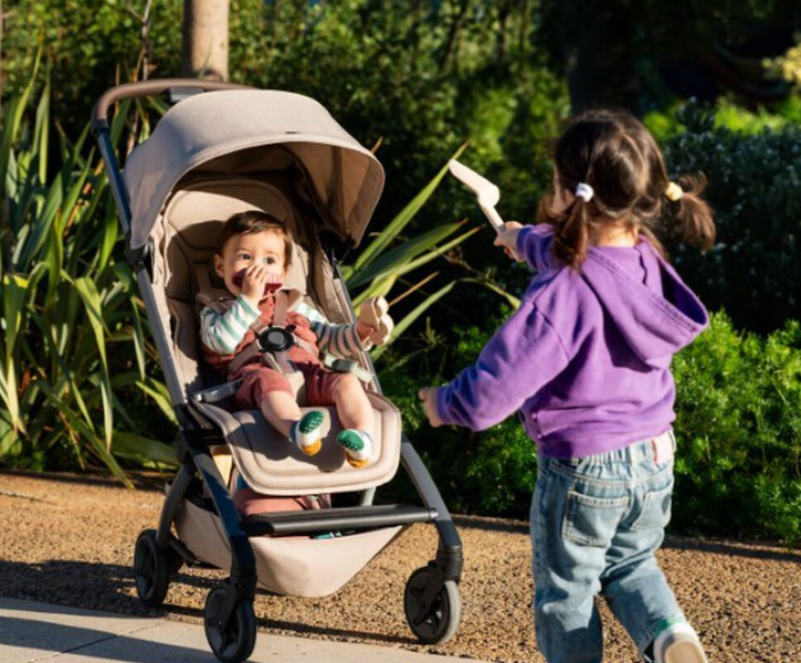 a toddler and baby in the Joolz Aer² lightweight stroller perfect for travel