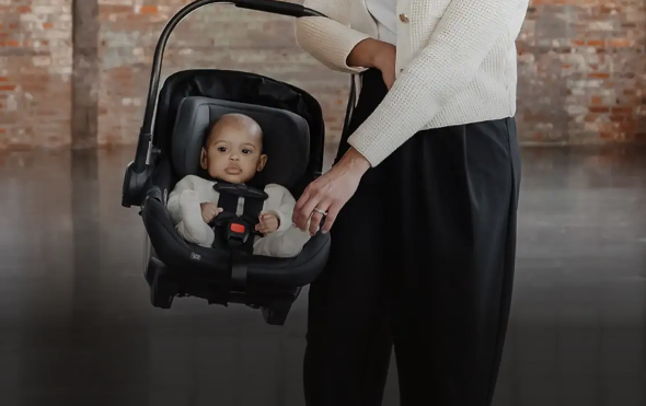 UPPAbaby Aria 2 vs. UPPAbaby Mesa V3; woman carrying aria v2 car seat