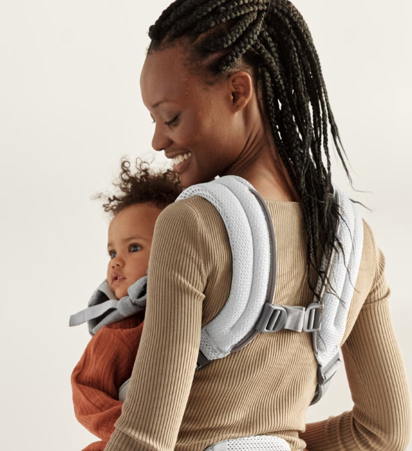 woman wearing baby bjorn harmony