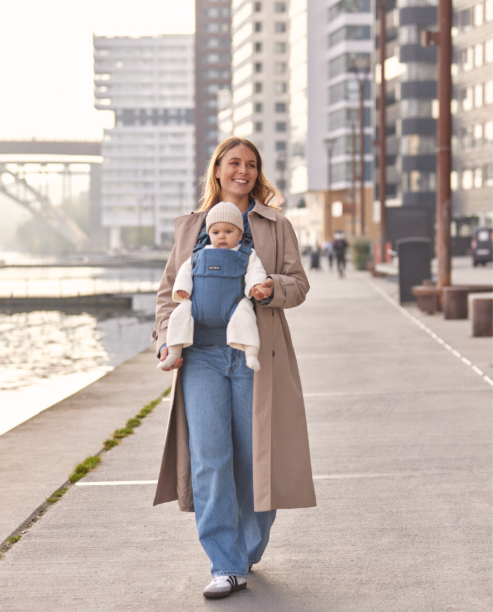 Woman front carrying baby in Baby Bjorn carrier