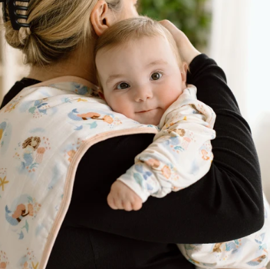 baby feeding with a burp cloth loulou lollipop