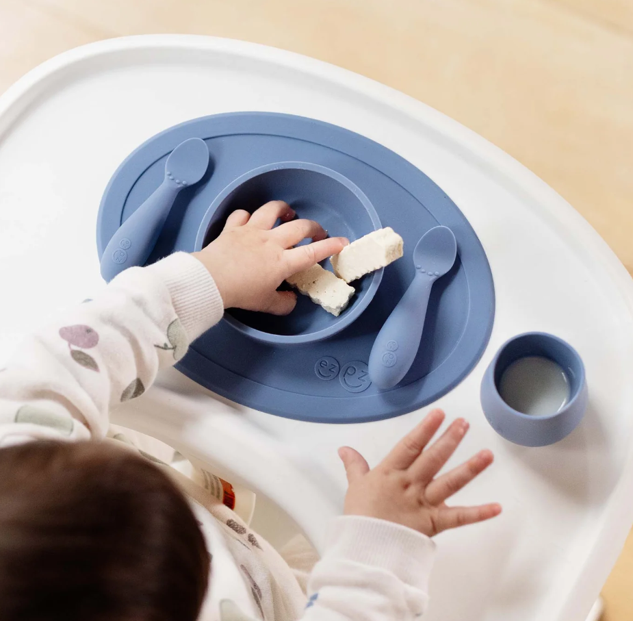 baby eating from ezpz plate