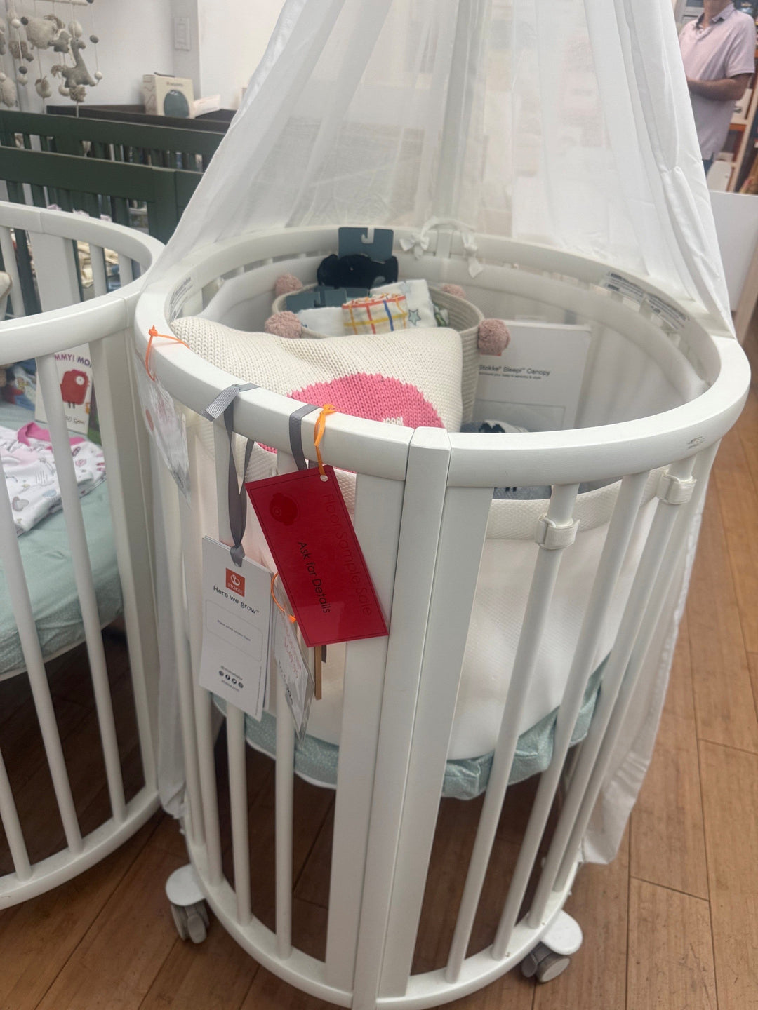 stokke mini crib on floor sample sale