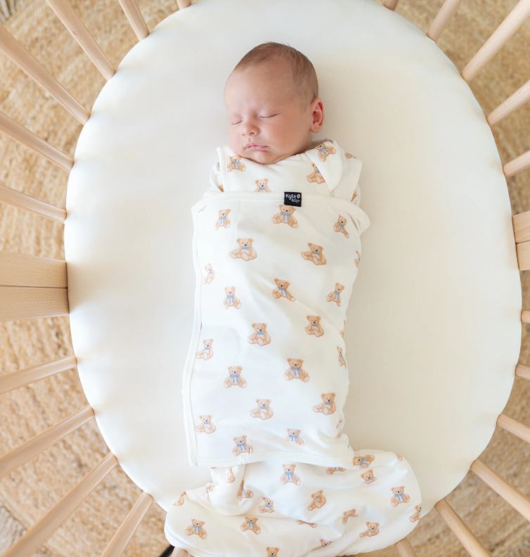 baby in Kyte baby swaddle sleep sack