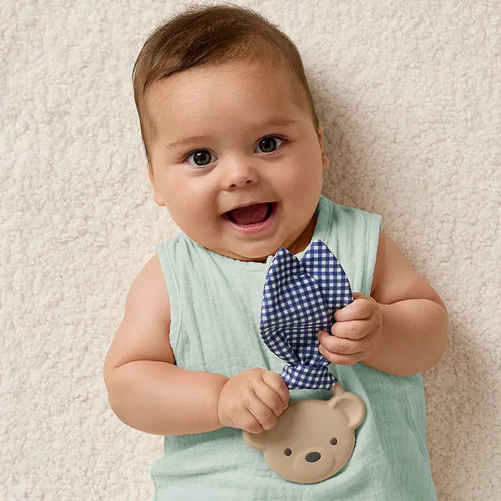baby holding Crinkle Crew Taupe Bear