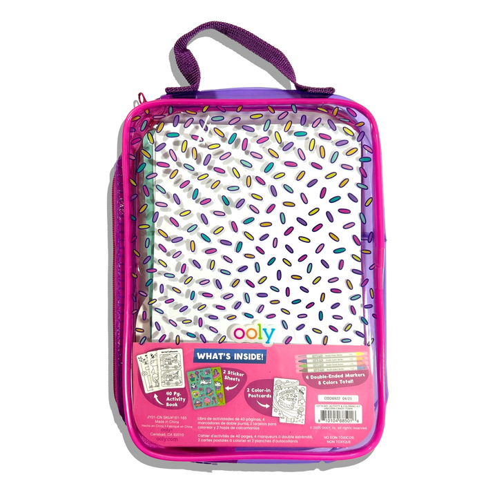 Pink and purple activity kit with colorful sprinkles on a white background