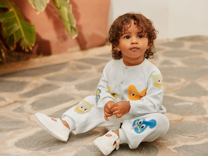 child wearing Sol Wave Crest Knit Pants by Molo