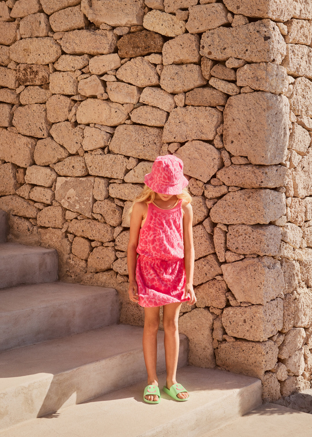 Girl wearing Lemon Quote Terry Sun Hat by Molo