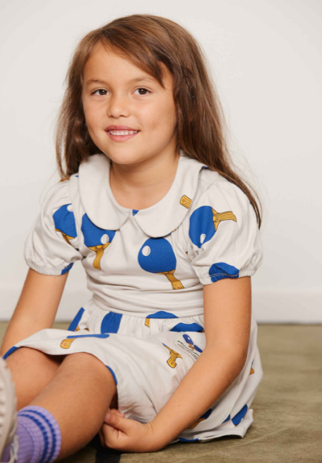 girl wearing Table Tennis AOP SS Dress by Mini Rodini
