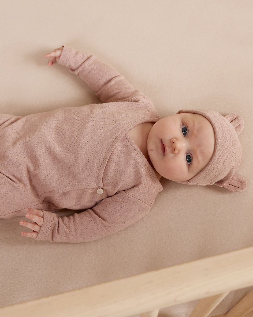 Mauve pointelle wrap footie by quincy mae