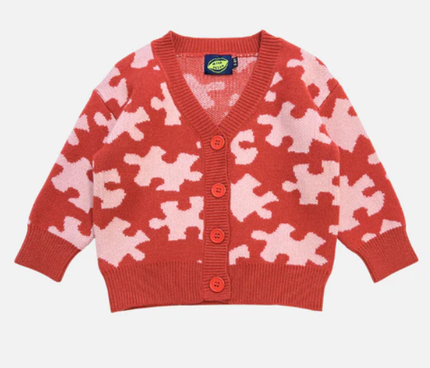 Milk Teeth Red Puzzle Sweater featuring playful geometric knit pattern in soft cotton, laid flat on a neutral background