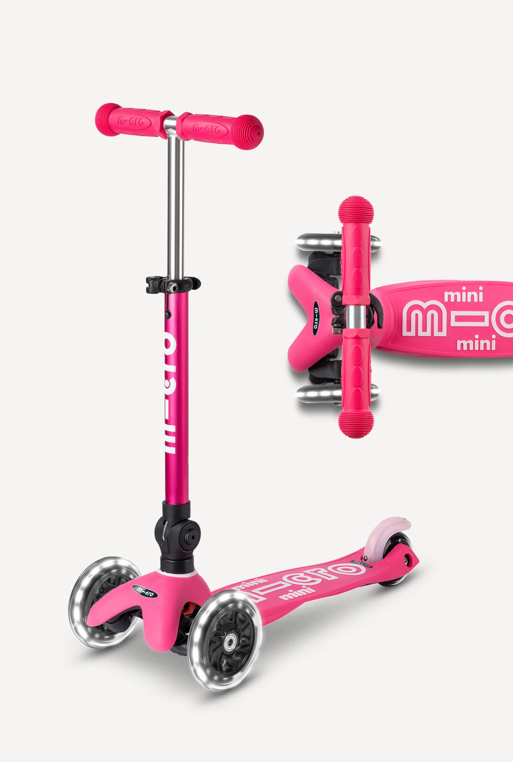 Pink scooter with adjustable handlebar on a white background