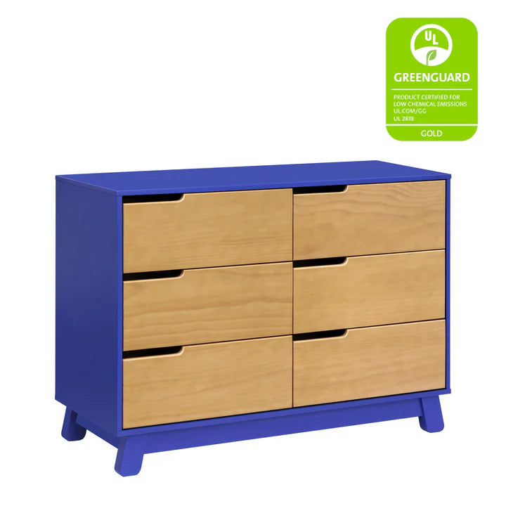 Blue dresser with wooden drawers and Greenguard Gold certification badge on a white background