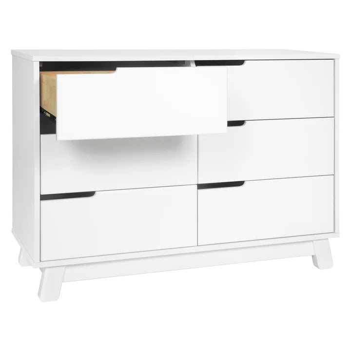 White dresser with multiple drawers on a white background