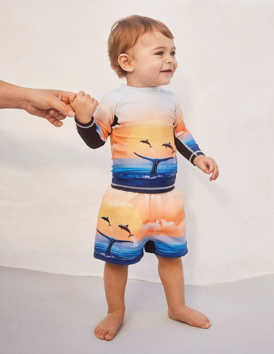 Boy wearing Newton Ocean Smile swimsuit by Molo