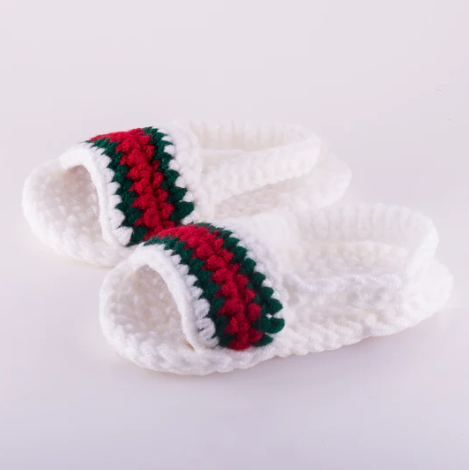 white crochet slides by Diaper book club