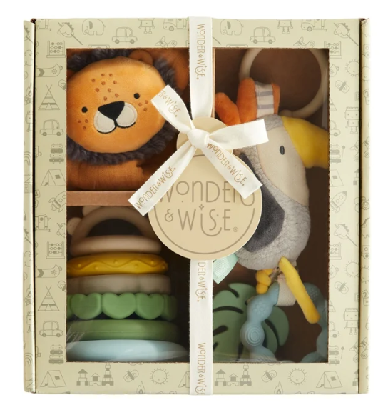 Wonder & Wise baby gift set in a decorative cream-colored box with a window, featuring a plush lion, elephant, and stacked rings tied with a cream ribbon.